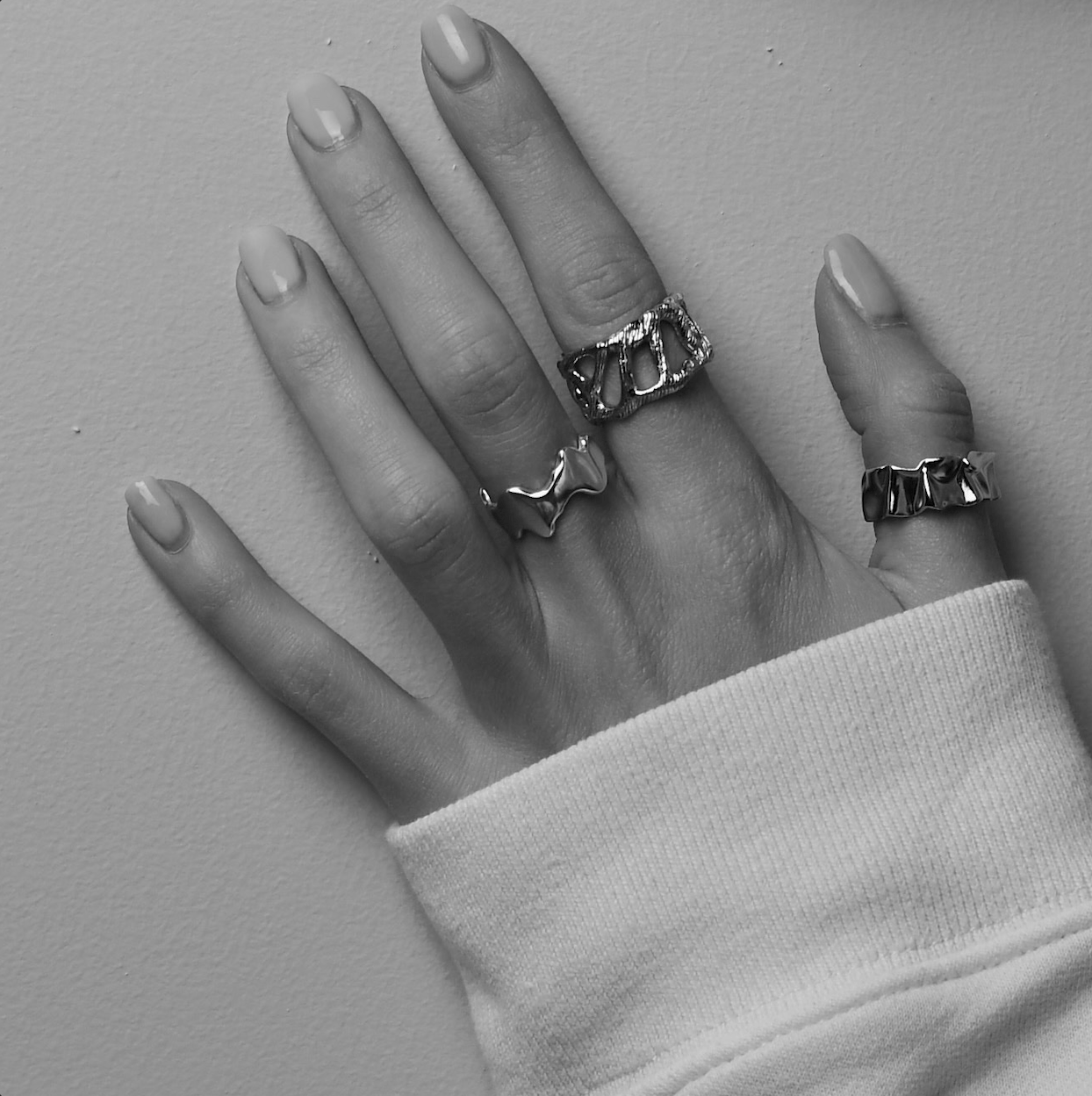 Silver rings on a female hand, aesthetics