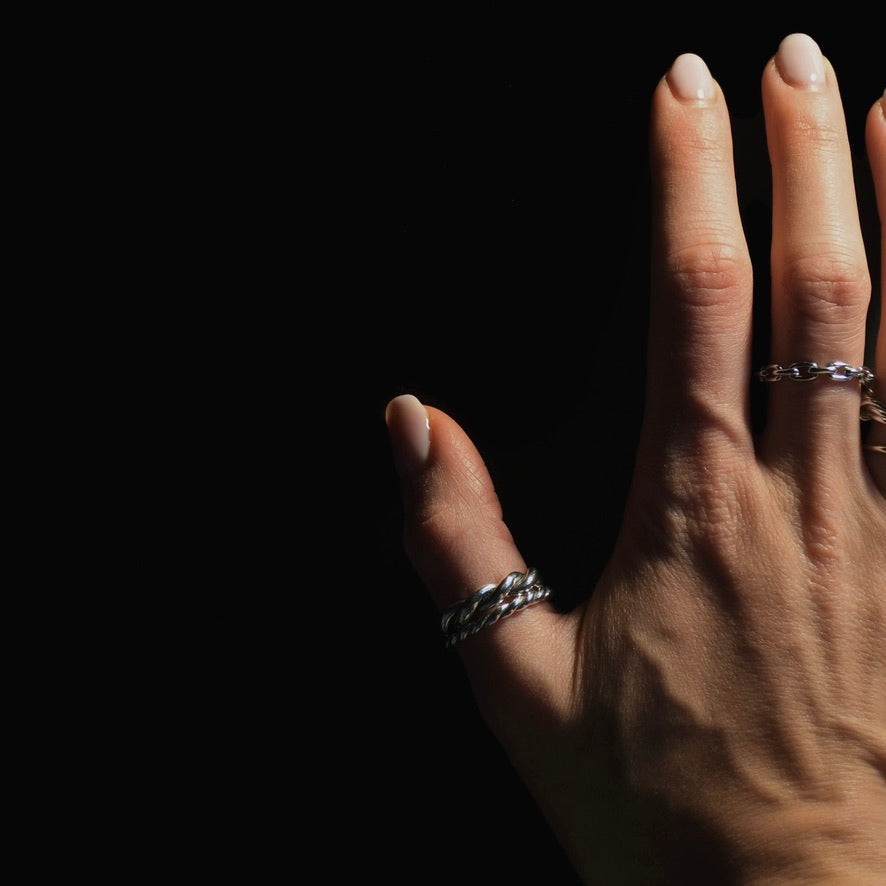Dark setup of rings on a female hand